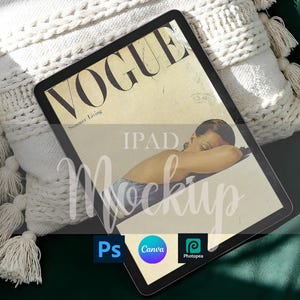 May include: An iPad mockup featuring a vintage Vogue magazine cover with a woman resting. The tablet is placed on a white, textured pillow with tassels. The image includes the text "IPAD Mockup" and icons for Photoshop, Canva, and Photopea.