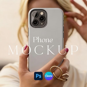 May include: A silver smartphone held in a hand with a gold ring. The phone has a triple-lens camera and the words "Phone MOCKUP" are displayed on the screen. The image also includes the logos for Photoshop and Canva.