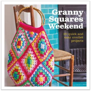 May include: A colourful crocheted tote bag with a wooden handle. The bag is made of granny squares in pink, yellow, blue, and green. The title "Granny Squares Weekend" and the text "20 quick and easy crochet projects" are visible on the cover.