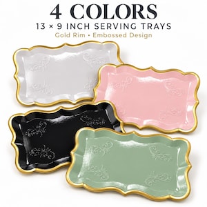 May include: Four rectangular serving trays measuring 13 by 9 inches, featuring a gold rim and an embossed design. The trays are available in white, pink, black, and sage green, each with a scalloped edge and a glossy finish on the surface.