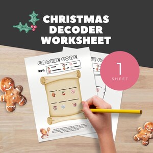 May include: Christmas Decoder Worksheet with the text "Christmas Decoder Worksheet" at the top. The worksheet has a "Cookie Code" with a key and illustrations. A hand is holding a yellow pencil, writing on the worksheet. Two gingerbread cookies are on the table.