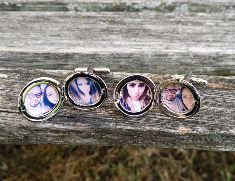 May include: Silver cufflinks with a hinged locket design. Each locket features a different photo of a couple.