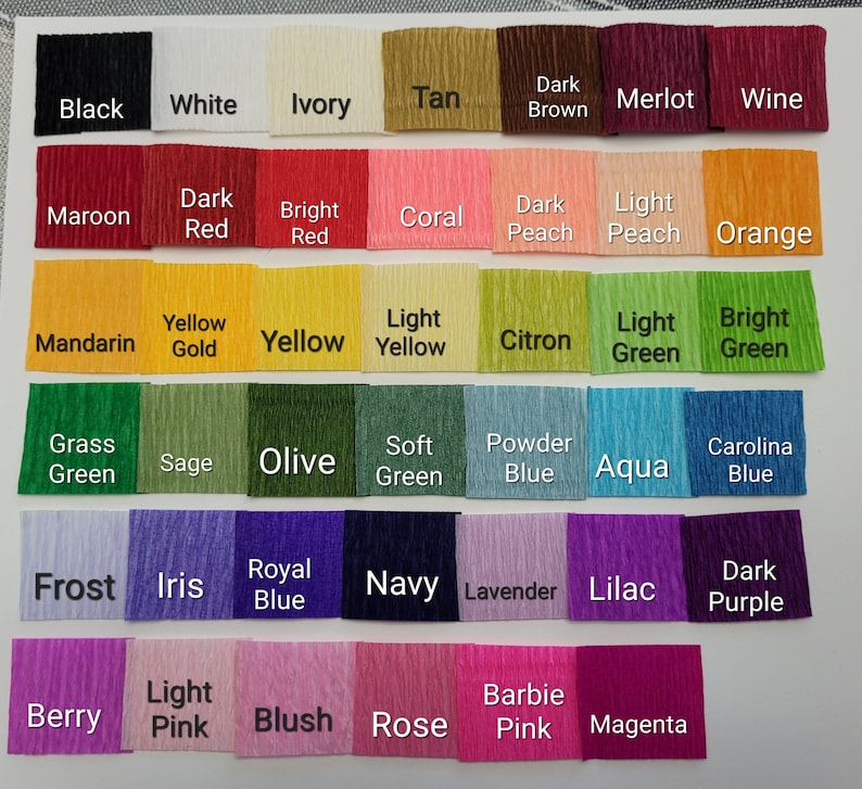May include: A color chart of 36 different colors of crepe paper. The colors are arranged in rows and columns. The colors include black, white, ivory, tan, dark brown, merlot, wine, maroon, dark red, bright red, coral, dark peach, light peach, orange, mandarin, yellow gold, yellow, light yellow, citron, light green, bright green, grass green, sage, olive, soft green, powder blue, aqua, carolina blue, frost, iris, royal blue, navy, lavender, lilac, dark purple, berry, light pink, blush, rose, barbie pink, and magenta.