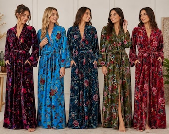 May include: Five floor-length velvet robes with long sleeves, a tie waist, and side pockets. Each robe features a distinct floral pattern in various colors including deep purple, bright blue, dark teal, olive green, and vibrant red with floral prints.