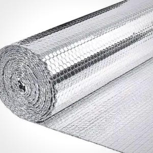 May include: A roll of silver reflective insulation material. The material has a bubble-like texture and is tightly rolled, revealing the layers. The shiny surface reflects light, creating a bright appearance. The insulation is likely used for thermal regulation.