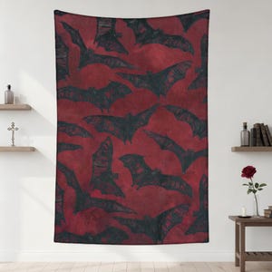 May include: A red tapestry featuring a repeating pattern of black bat illustrations. The bats are depicted with outstretched wings, creating a dynamic and spooky design. The tapestry is suitable for Halloween or gothic-themed decor.