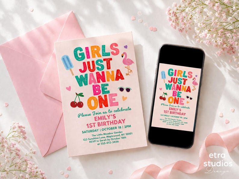 May include: A birthday invitation with the text "Girls Just Wanna Be One" in colorful letters, featuring a popsicle, cherries, sunglasses, and a flamingo. A pink envelope and a smartphone displaying the same design are also present.