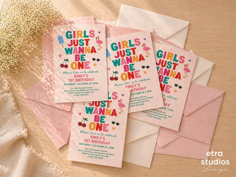 May include: Pink birthday invitations with the text "GIRLS JUST WANNA BE ONE" in colorful letters. The invitations feature illustrations of a popsicle, sunglasses, cherries, and a flamingo. The invitations are surrounded by pink and cream envelopes.