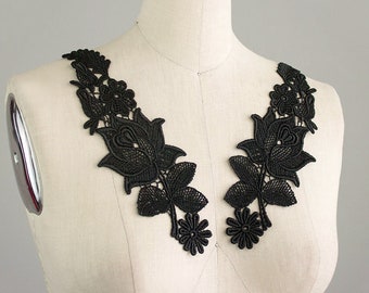 May include: Black lace trim with a floral design featuring large roses and leaves. This trim is perfect for adding a touch of elegance to any garment.