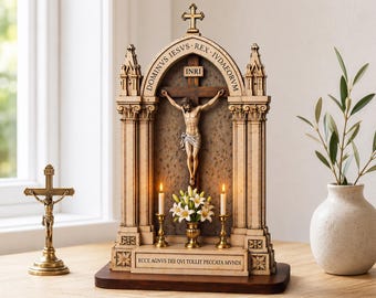 May include: A detailed wooden religious shrine featuring a crucifix with the inscription "INRI." The shrine includes two lit candles, a small vase of white flowers, and the text "DOMINUS IESUS REX IUDAEORUM." A small gold crucifix is on the left.