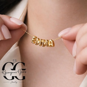 May include: A set of three ceramic mugs with a speckled, matte finish. The mugs are in shades of cream, light gray, and dark gray. Each mug has a simple, minimalist design, perfect for coffee or tea.