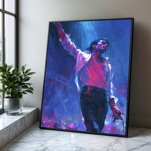 Puede incluir: Impresión artística enmarcada de un artista en el escenario, con vibrantes tonos azules, morados y rosas. El sujeto lleva una camisa blanca y pantalones negros, con un brazo levantado. La obra se exhibe sobre una superficie de mármol.