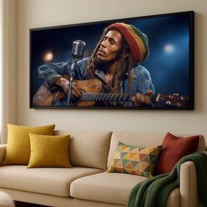 May include: A framed print of a musician playing a guitar and singing into a microphone. The musician is wearing a denim jacket and a hat with red, yellow, and green stripes. The image is displayed above a beige sofa with colourful throw pillows.