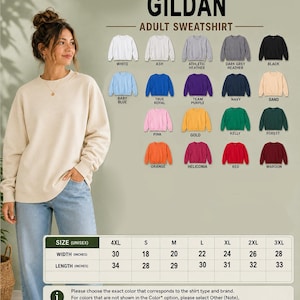 a woman standing in front of a wall with a selection of colorful adult sweatshirts displayed on it.