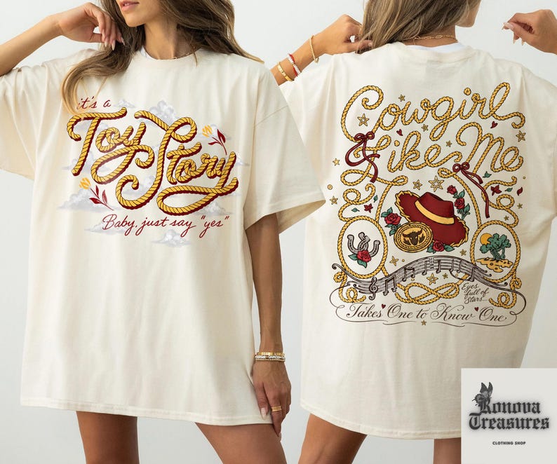 two white t-shirts with a cowboy theme. The t-shirt on the left has a red and gold design with the text "It's a Toy Story Baby just say 'yep'" and a cowboy hat. The t-shirt on the right has a red and gold design with the text "Cowsgirl Like Me Takes One to Know One" and a cowboy hat.