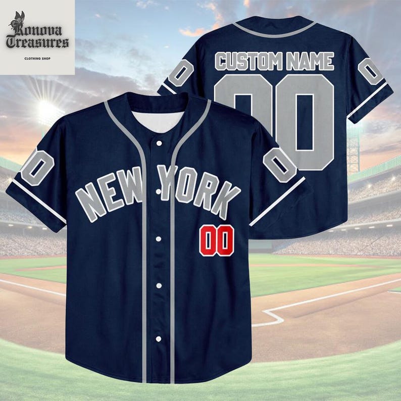 A navy blue baseball jersey with the text "NEW YORK" and the number "00" printed on it, along with a custom name and number. The jersey is displayed against a backdrop of a baseball field.