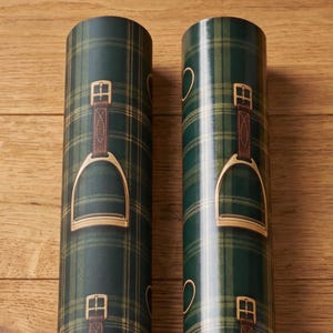 dark green plaid gift wrap with gold stirrup and snaffle bit luxury wrapping paper old money equestrian aesthetic Christmas birthday gift wrap