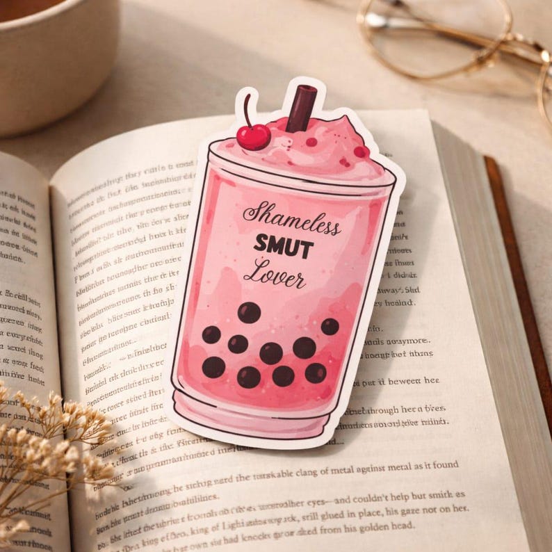 Funny bookmark for book lovers pink boba design romance reader gift on open book