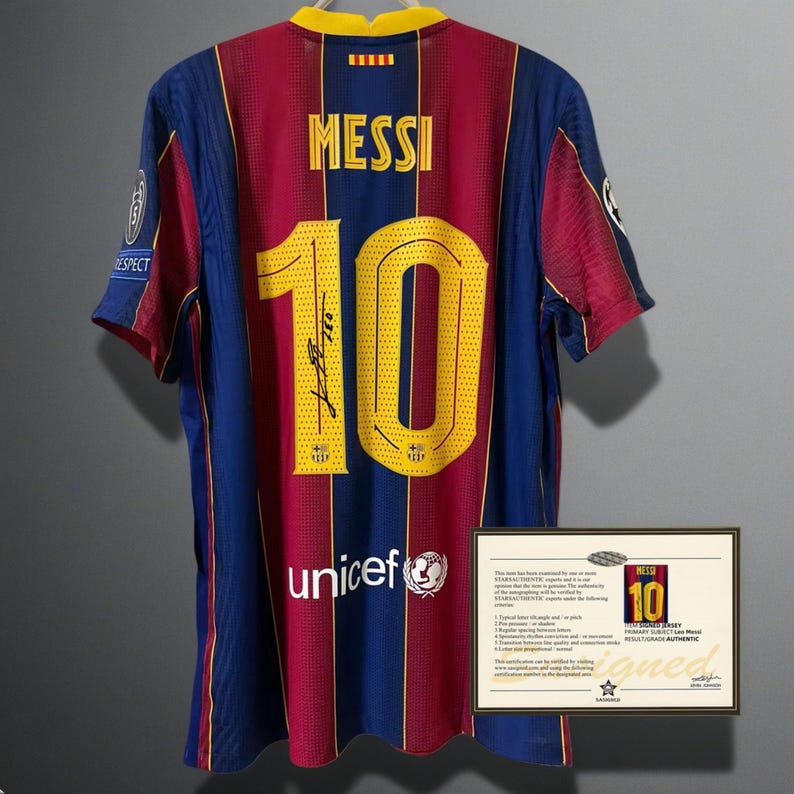 May include: A Barcelona soccer jersey with the name "MESSI" and the number "10" in gold lettering. The jersey is primarily blue and maroon with a yellow collar. The jersey has a "unicef" logo and a signature.
