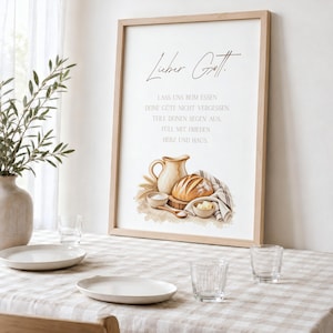 Könnte beinhalten: Ein gerahmtes Wandbild mit dem deutschen Text 'Lieber Gott. LASS UNS BEIM ESSEN DEINE GÜTE NICHT VERGESSEN. TEILE DEINEN SEGEN AUS. FÜLL MIT FRIEDEN HERZ UND HAUS.' und einer Aquarellillustration von einem Krug, Brot und kleinen Schalen.