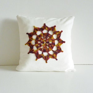 Crochet motif cushion compass design white cotton with gorgeous autumn coloured motif image 1