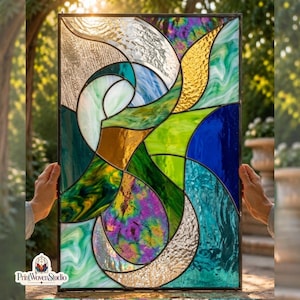 May include: A rectangular stained glass panel featuring an abstract composition of curved shapes in shades of blue, green, yellow, and purple. The glass pieces exhibit varied textures, including smooth, rippled, and iridescent finishes, all joined by dark metal lines.
