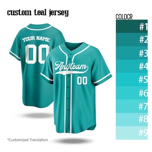 May include: Teal baseball jersey with white accents, featuring the text "Anyteam" and the number "00". The back of the jersey displays "YOUR NAME" and the number "00". The image also shows a color chart.