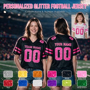 May include: A black football jersey with pink glitter lettering and numbers. The front displays "TEAM NAME" and "00", while the back shows "YOUR NAME" and "00". A small inset shows a child wearing a white jersey with pink glitter details.