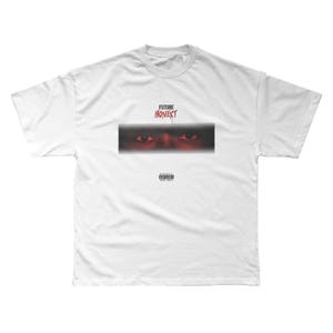 May include: White t-shirt featuring the text "FUTURE HONEST" above a rectangular graphic of red eyes. Below the graphic is a small "Parental Advisory" label. The shirt is a basic crew neck.