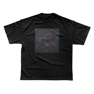 May include: Black t-shirt featuring a square graphic of a rose with red and orange highlights. The rose is surrounded by dark leaves, creating a striking contrast against the black fabric. The design has a slightly distressed, artistic look.
