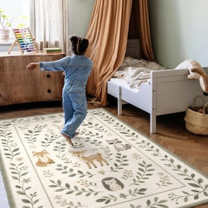 A young girl in a denim jumpsuit stands in a bedroom with a wooden dresser, a canopy bed, and a rug featuring a forest scene.