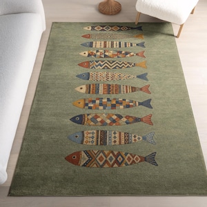 a green rug with a unique fish design on it, placed on a wooden floor next to a white couch.