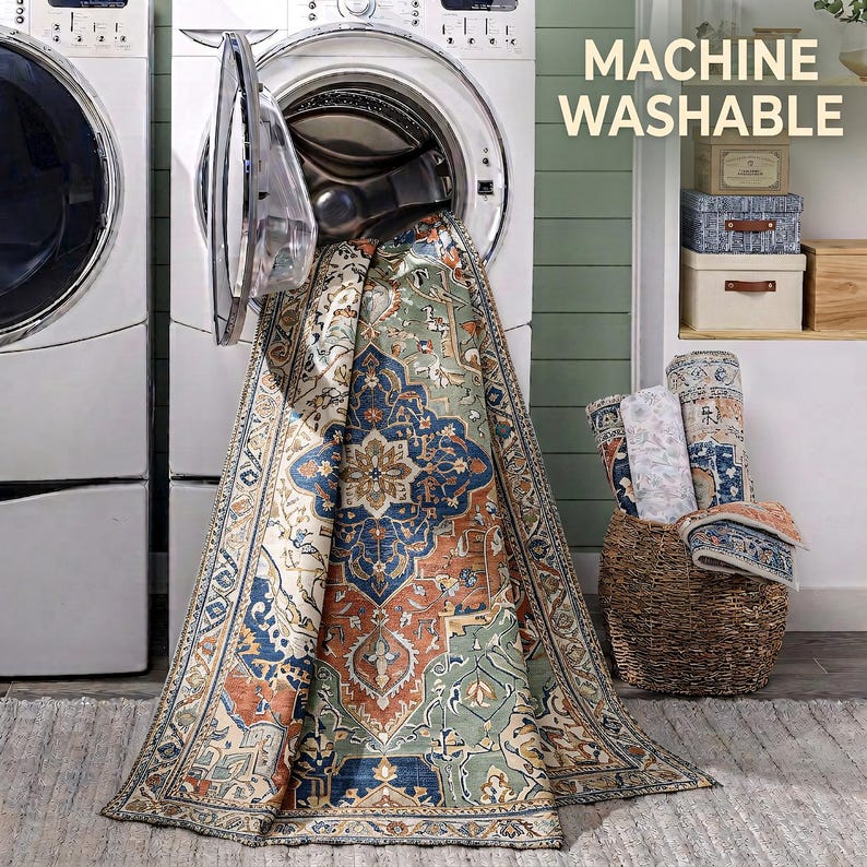 a large rug with a colorful, intricate design hanging from an open washing machine in a laundry room.