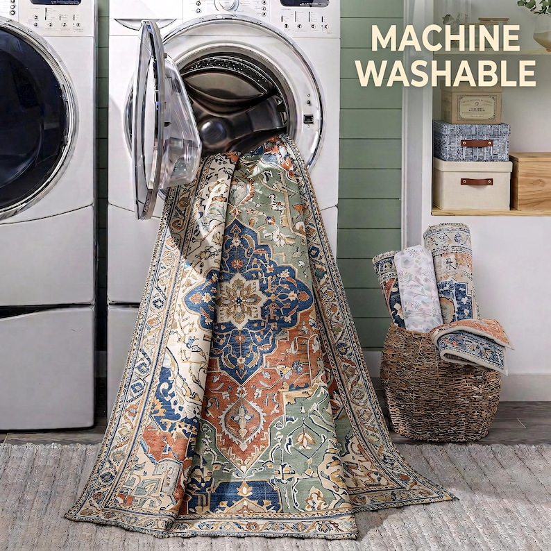 a large rug with a colorful, intricate design hanging from an open washing machine in a laundry room.