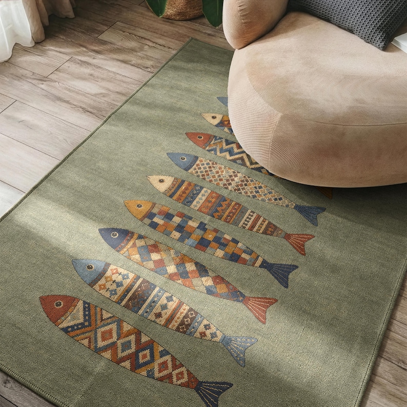 a rug with a fish design on it, placed on a wooden floor next to a beige armchair.