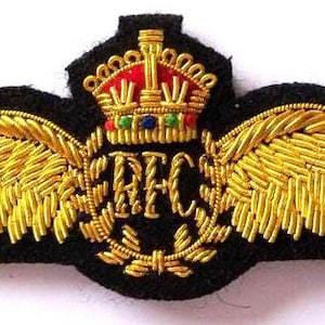 May include: A white ceramic mug with a black handle and the text "But First, Coffee" in a black, bold font. The mug is sitting on a wooden surface. The mug is 4 inches tall.