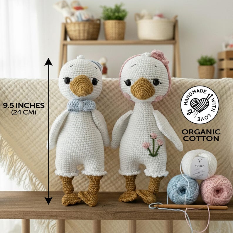 Two adorable handmade amigurumi crochet goose toys, measuring 9.5 inches (24 cm) tall, with "Handmade with Love" and "Organic Cotton" labels. Ideal for a toddler gift or a cherished goose plush.