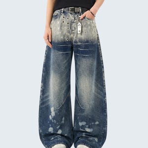 Washed Denim Jeans | Studded Wide Leg Pants | Daily Wear | Y2K Streetwear Style

Washed denim jeans with a wide leg silhouette and studded eyelet detailing, featuring a loose fit suitable for streetwear outfits, casual styling, and everyday wear with a Y2K-inspired look.