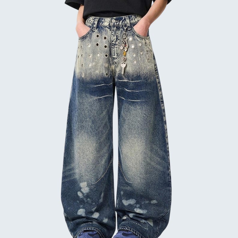 Washed Denim Jeans | Studded Wide Leg Pants | Daily Wear | Y2K Streetwear Style

Washed denim jeans with a wide leg silhouette and studded eyelet detailing, featuring a loose fit suitable for streetwear outfits, casual styling, and everyday wear with a Y2K-inspired look.