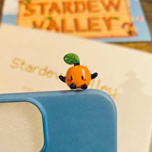 May include: A set of three ceramic mugs with a speckled, matte finish. The mugs are in shades of cream, light gray, and dark gray. Each mug has a simple, minimalist design, perfect for coffee or tea.