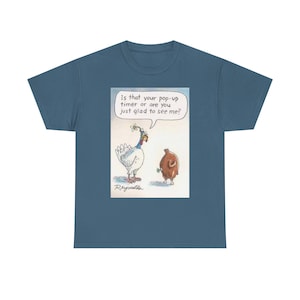 May include: A blue t-shirt featuring a cartoon illustration of two turkeys. One turkey is white with a red and blue neck, and the other is brown. Text in a speech bubble reads, "Is that your pop-up timer or are you just glad to see me?"