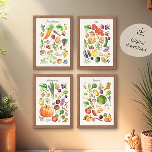 Peut inclure: Quatre impressions encadrées à l'aquarelle présentant des légumes de saison. Les impressions sont étiquetées "Printemps", "Été", "Automne" et "Hiver", chacune affichant une variété de produits colorés. Les cadres sont bruns, et le fond est beige neutre.