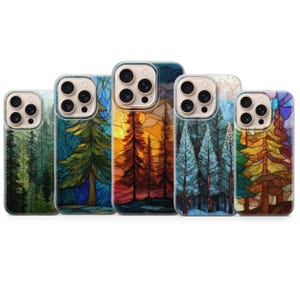 May include: A collection of five phone cases with nature-themed designs. Each case features a different forest scene, with vibrant colors and artistic renderings of trees and landscapes. The cases have a clear border and are designed to fit various phone models.