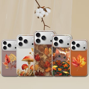 May include: Five clear smartphone cases featuring autumn-themed designs. The designs include a bouquet of fall leaves, red and white mushrooms, a dense pattern of fallen leaves, a kitten peeking through orange foliage, and a single maple leaf.