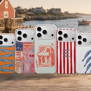 May include: Five smartphone cases arranged in a row, each featuring distinct sardine-themed designs. The patterns include blue fish on orange, colorful sardine tin labels, a red line-art illustration, red and white vertical stripes, and blue fish.