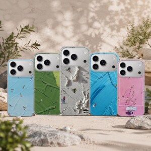 May include: Five smartphone cases featuring textured, impasto-style paint backgrounds in light blue, green, white, bright blue, and pink. Each case displays miniature figures engaged in sports like skiing, surfing, and basketball on the surface.