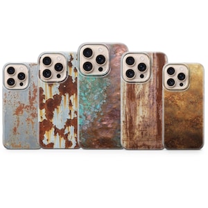 May include: Five phone cases with a weathered, industrial aesthetic. The cases feature textures resembling rusted metal, with colors ranging from gray and brown to teal and gold. Each case has a camera cutout.