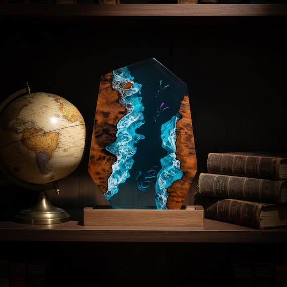 A handcrafted resin-and-wood lamp encasing a miniature octopus deep-sea scene that glows from within — functional art you actually want on your nightstand.