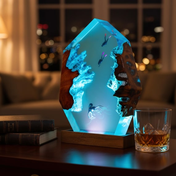 A glowing deep-sea diorama sealed inside epoxy and wood — the octopus tentacles lit from within is genuinely 'how did they make that?' territory.