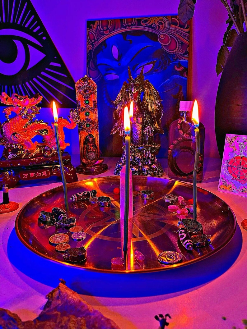 May include: A spiritual altar with lit candles, a decorative brass plate, and various figurines. The altar includes a golden dragon statue, a deity painting, and a bottle with a purple liquid. The scene is illuminated with purple and blue lighting.